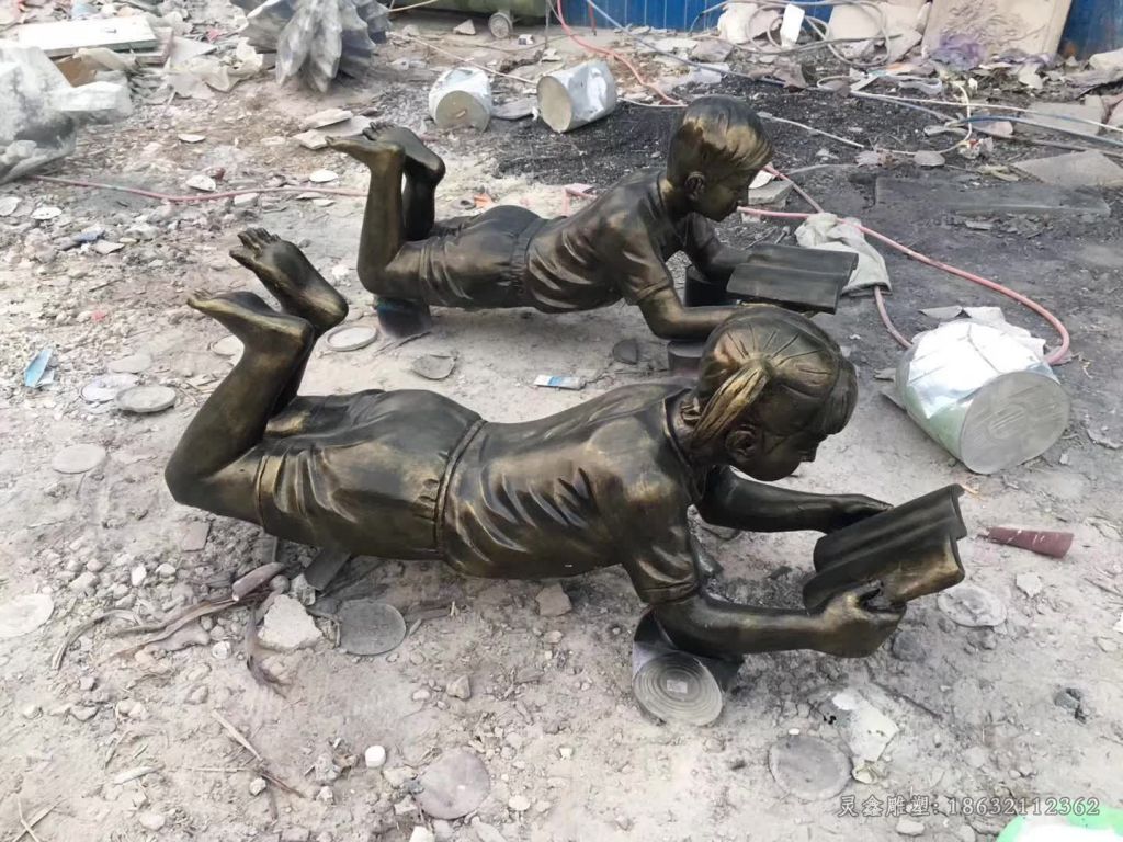新余趴着看书小女孩人物铜雕